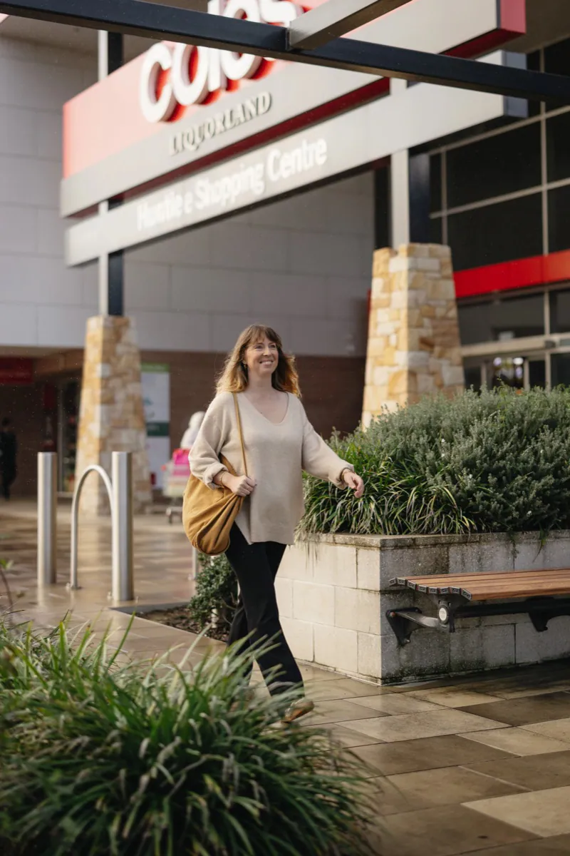 Resident walking through Huntlee Town Centre